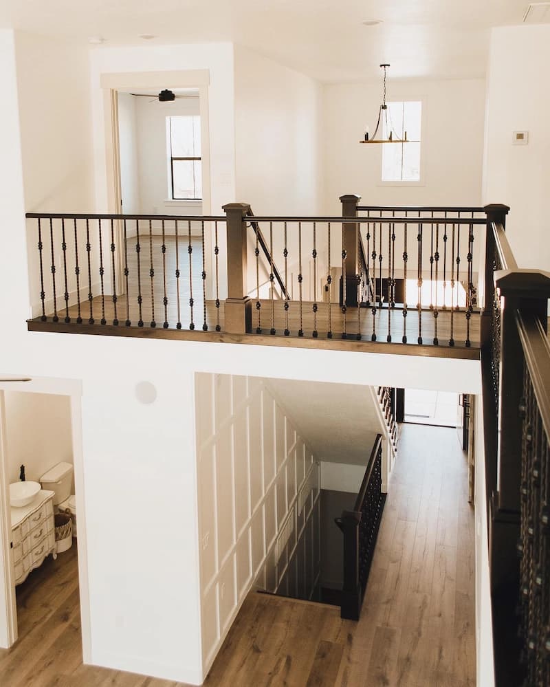 modern house stairway with wooden floors and wrap around balcony