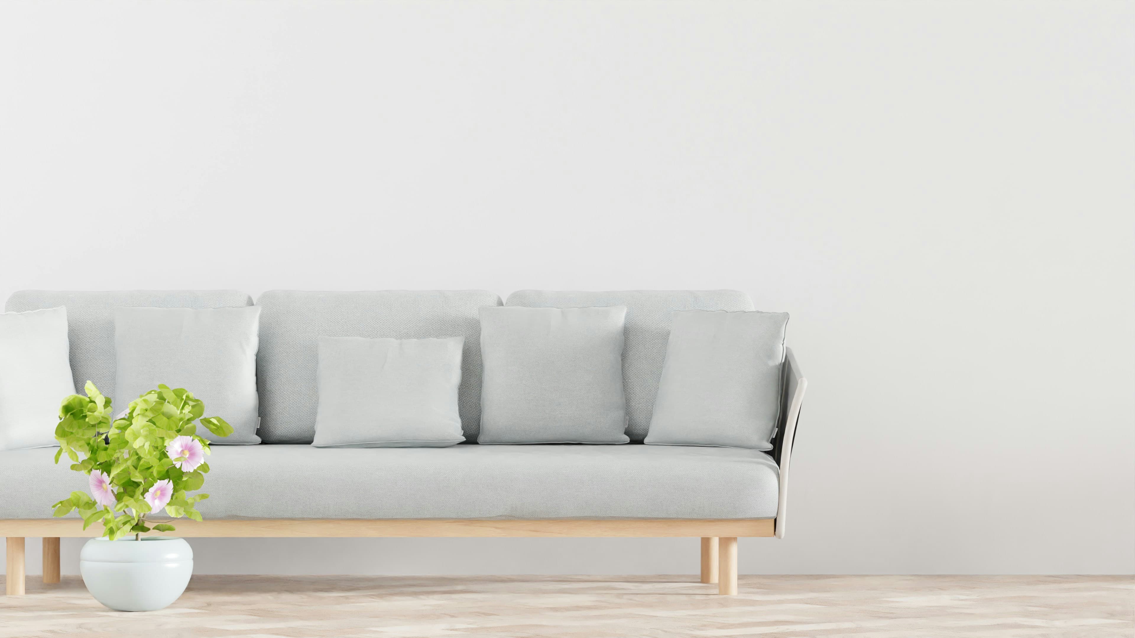 A modern room with a yellow chair in the center standing on beautiful wood floors. Photo by Kam Idris on Unsplash